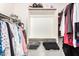 Walk-in closet features built-in shelving and ample storage for clothing and accessories at 13216 W Desert Ln, Surprise, AZ 85374