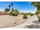 Desert landscaping in the common area, with walking paths and scenic views at 13216 W Desert Ln, Surprise, AZ 85374
