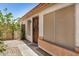Home's front entrance featuring a screened security door and a 'Welcome' mat at 13216 W Desert Ln, Surprise, AZ 85374