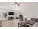 Open living room with neutral tones, tile floors, a ceiling fan, and modern furniture at 13216 W Desert Ln, Surprise, AZ 85374
