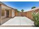 Private, spacious patio surrounded by block fencing and a gate leads to open space at 13216 W Desert Ln, Surprise, AZ 85374