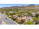 A neighborhood view from above, with mature trees and landscaping, near a main road at 1326 W Joan De Arc Ave, Phoenix, AZ 85029
