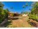 Expansive backyard with mature trees and shed, offering plenty of space for outdoor activities at 1326 W Joan De Arc Ave, Phoenix, AZ 85029