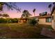Lush backyard with covered patio creating an inviting outdoor living area at 1326 W Joan De Arc Ave, Phoenix, AZ 85029