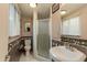 Bathroom with tiled shower, vanity, toilet and lots of natural light at 1326 W Joan De Arc Ave, Phoenix, AZ 85029