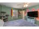Well-lit bedroom with decoratively painted walls, bright window view, and modern ceiling fan at 1326 W Joan De Arc Ave, Phoenix, AZ 85029