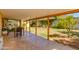Covered patio area, perfect for outdoor dining and entertaining, overlooking the spacious backyard at 1326 W Joan De Arc Ave, Phoenix, AZ 85029