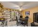 Dining room features a table with seating, decorative shelving, and natural light from the window at 1326 W Joan De Arc Ave, Phoenix, AZ 85029