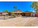 Inviting single-story home with stone accents, mature landscaping, and a spacious driveway at 1326 W Joan De Arc Ave, Phoenix, AZ 85029