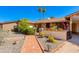 Welcoming front entryway with a brick pathway and well-manicured garden at 1326 W Joan De Arc Ave, Phoenix, AZ 85029