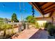 Charming brick-lined yard with lush landscaping and stone accents at 1326 W Joan De Arc Ave, Phoenix, AZ 85029