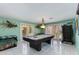 Spacious game room featuring a pool table, large windows, and tile flooring at 1326 W Joan De Arc Ave, Phoenix, AZ 85029