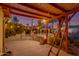 Charming patio with wooden ladder near outdoor space featuring string lights and views of the pool at 1326 W Joan De Arc Ave, Phoenix, AZ 85029