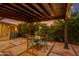 Covered patio with decorative table and seating providing a cozy outdoor dining space at 1326 W Joan De Arc Ave, Phoenix, AZ 85029