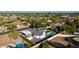 Gorgeous aerial view of a modern home with a backyard pool and lush landscaping at 14012 N 57Th Pl, Scottsdale, AZ 85254