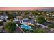 Aerial view of the house showing a pool and patio area, set against a picturesque mountain backdrop at 14012 N 57Th Pl, Scottsdale, AZ 85254