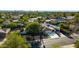 Aerial view of suburban neighborhood with palm trees, manicured lawns, and a charming house at 14012 N 57Th Pl, Scottsdale, AZ 85254