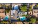 Stunning bird's-eye view showcasing the house, pool, and manicured lawn at 14012 N 57Th Pl, Scottsdale, AZ 85254