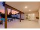 Covered patio with lounge seating and a view of the pool, perfect for relaxing evenings and entertaining guests at 14012 N 57Th Pl, Scottsdale, AZ 85254
