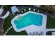 Aerial view of a backyard pool and hot tub with surrounding landscape and lighting, creating a relaxing outdoor oasis at 14012 N 57Th Pl, Scottsdale, AZ 85254