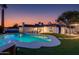 Backyard pool and lounge area with a jacuzzi and covered patio, set against a colorful sunset at 14012 N 57Th Pl, Scottsdale, AZ 85254