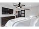 Sunlit main bedroom with a ceiling fan, generous closet space, and neutral tones at 14012 N 57Th Pl, Scottsdale, AZ 85254