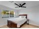 Comfortable bedroom with natural light, ceiling fan, and a cozy atmosphere at 14012 N 57Th Pl, Scottsdale, AZ 85254