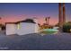 Modern home exterior with pool and landscaped yard, offering a private oasis for relaxation and outdoor enjoyment at 14012 N 57Th Pl, Scottsdale, AZ 85254