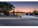 Charming single-story home with desert landscaping, a modern front entrance, and spacious driveway at 14012 N 57Th Pl, Scottsdale, AZ 85254