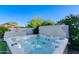 Inviting hot tub nestled in a private corner of the lush backyard, perfect for relaxation and unwinding at 14012 N 57Th Pl, Scottsdale, AZ 85254