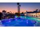 Inviting backyard with hot tub and ambient lighting, perfect for relaxing evenings or entertaining friends at 14012 N 57Th Pl, Scottsdale, AZ 85254