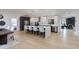 Bright, open kitchen with an island, modern white cabinetry, stylish pendant lighting, and stainless steel appliances at 14012 N 57Th Pl, Scottsdale, AZ 85254