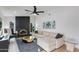 Cozy living room featuring a sleek fireplace, comfortable seating, and stylish decor at 14012 N 57Th Pl, Scottsdale, AZ 85254
