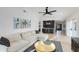 Inviting living room featuring a comfortable sectional sofa, stylish accents, and an open floor plan at 14012 N 57Th Pl, Scottsdale, AZ 85254