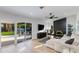 Inviting living room with modern furnishings, a fireplace, and sliding glass doors leading to the pool area at 14012 N 57Th Pl, Scottsdale, AZ 85254