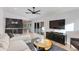 Bright living room with modern finishes, built-in bar, and sliding glass doors for natural light at 14012 N 57Th Pl, Scottsdale, AZ 85254