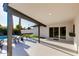 Charming covered patio with ample space and view of the backyard oasis featuring a sparkling pool at 14012 N 57Th Pl, Scottsdale, AZ 85254