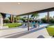 Covered patio overlooking a sparkling pool and manicured backyard, perfect for outdoor gatherings at 14012 N 57Th Pl, Scottsdale, AZ 85254