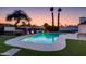 Backyard pool with a hot tub and landscape lighting at dusk at 14012 N 57Th Pl, Scottsdale, AZ 85254