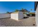 Backyard shed offers ample storage space with attached carport covered with aluminum at 14012 N 57Th Pl, Scottsdale, AZ 85254