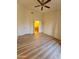 Spacious bedroom with wood-look floors and entry to the primary bathroom at 14250 W Wigwam Blvd # 1723, Litchfield Park, AZ 85340