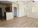 Bright open-concept layout with a kitchen bar, recessed lighting and vinyl wood flooring at 14250 W Wigwam Blvd # 1723, Litchfield Park, AZ 85340