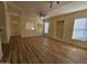 Open living room featuring recessed lighting, ceiling fan, wood-look floors, and built-in display shelves at 14250 W Wigwam Blvd # 1723, Litchfield Park, AZ 85340