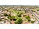 A large grassy park with shady trees and walking paths nestled in a residential area at 1501 S 122Nd Ave, Avondale, AZ 85323