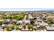 Aerial view of a residential neighborhood showcasing well-maintained homes and mature trees at 1501 S 122Nd Ave, Avondale, AZ 85323