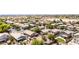 A peaceful neighborhood showing a cluster of homes with well-kept yards and mature trees at 1501 S 122Nd Ave, Avondale, AZ 85323