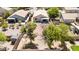The backyard has a small storage shed and mature trees that provide shade and privacy at 1501 S 122Nd Ave, Avondale, AZ 85323