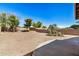 Expansive backyard featuring low-maintenance desert landscaping and privacy fencing at 1501 S 122Nd Ave, Avondale, AZ 85323