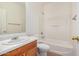 This bathroom features a sink, toilet, and tub/shower with white tiling at 1501 S 122Nd Ave, Avondale, AZ 85323