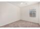 This bedroom offers a window with natural light and a ceiling fan at 1501 S 122Nd Ave, Avondale, AZ 85323